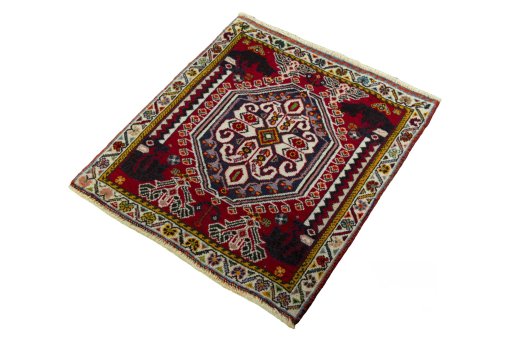 Corner detail of 2000s Shiraz rug showing border pattern and Wool pile