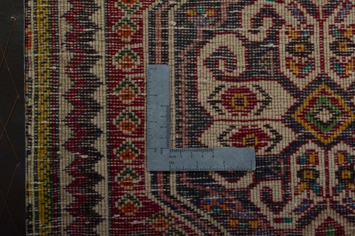 Backside of handmade 2000s Shiraz rug showing knot structure and weave density