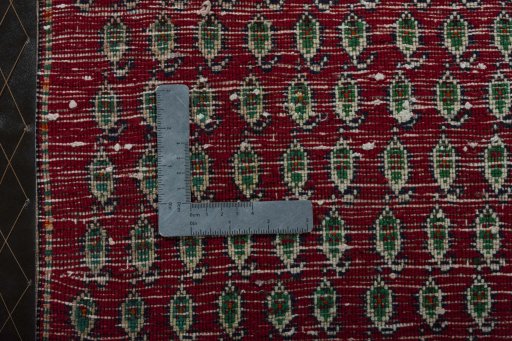 Backside of handmade 2000s Shiraz rug showing knot structure and weave density