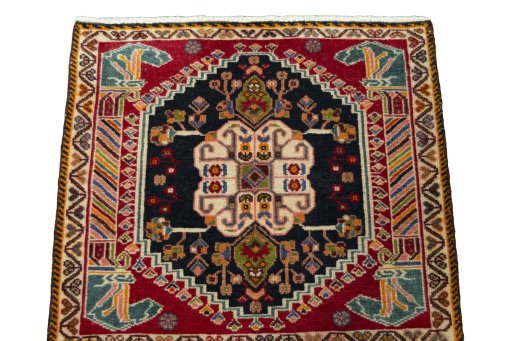 Surface texture of 2000s Shiraz rug with natural Wool and intricate pattern