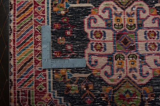 Backside of handmade 2000s Shiraz rug showing knot structure and weave density