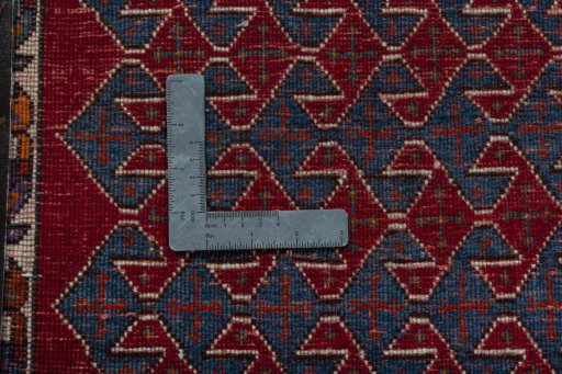 Backside of handmade 2000s Shiraz rug showing knot structure and weave density