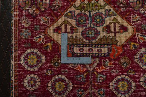 Backside of handmade 2000s Shiraz rug showing knot structure and weave density