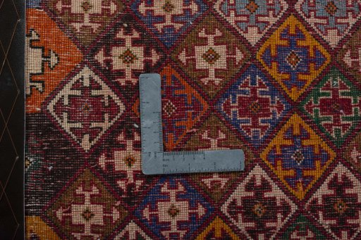 Backside of handmade 2000s Shiraz rug showing knot structure and weave density