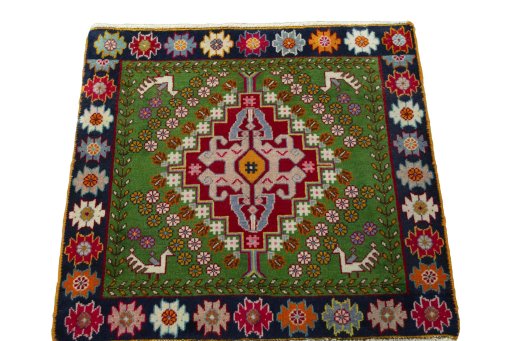 Surface texture of 2000s Shiraz rug with natural Wool and intricate pattern