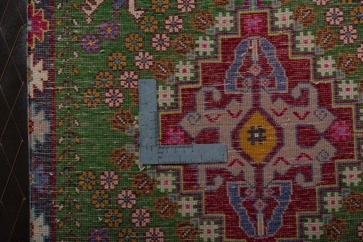 Backside of handmade 2000s Shiraz rug showing knot structure and weave density