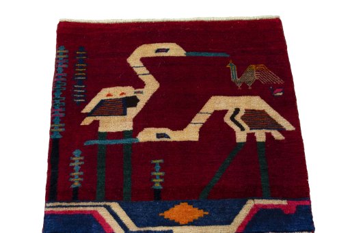 Surface texture of 2000s Shiraz rug with natural Wool and intricate pattern