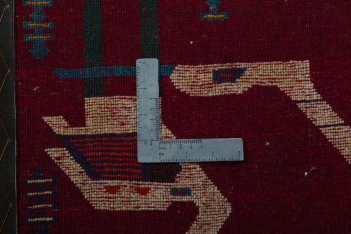Backside of handmade 2000s Shiraz rug showing knot structure and weave density