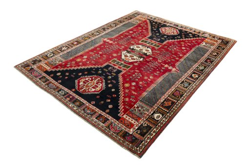 Corner detail of 2000s Shiraz rug showing border pattern and Wool pile