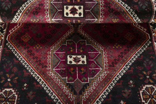 Full view of 2000s Shiraz rug from Iran / Persia, 160 × 107 cm in Red tones