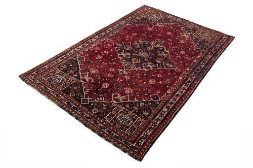 Corner detail of 2000s Shiraz rug showing border pattern and Wool pile