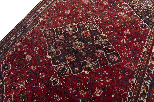 Backside of handmade 2000s Shiraz rug showing knot structure and weave density