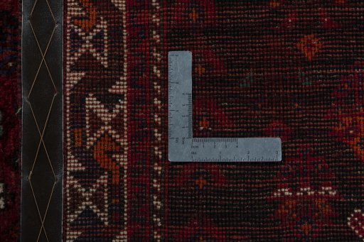 Corner detail of 2000s Shiraz rug showing border pattern and Wool pile