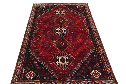 Surface texture of 2000s Shiraz rug with natural Wool and intricate pattern