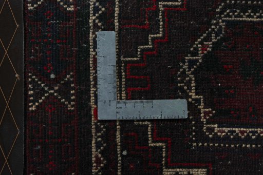 Backside of handmade 2000s Shiraz rug showing knot structure and weave density