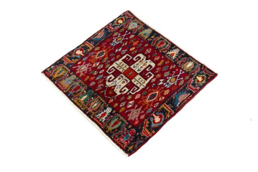 Corner detail of 2000s Shiraz rug showing border pattern and Wool pile