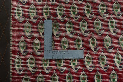 Backside of handmade 2000s Shiraz rug showing knot structure and weave density