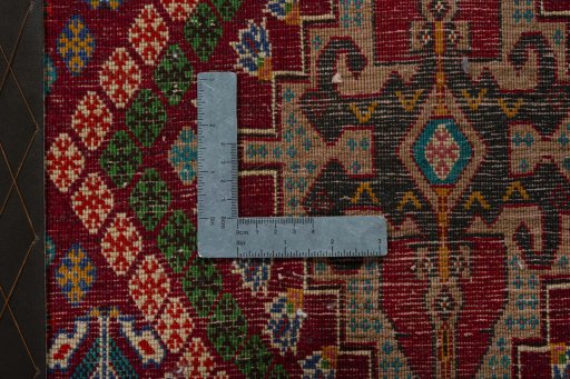 Backside of handmade 2000s Shiraz rug showing knot structure and weave density