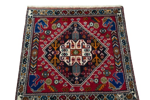 Surface texture of 2000s Shiraz rug with natural Wool and intricate pattern
