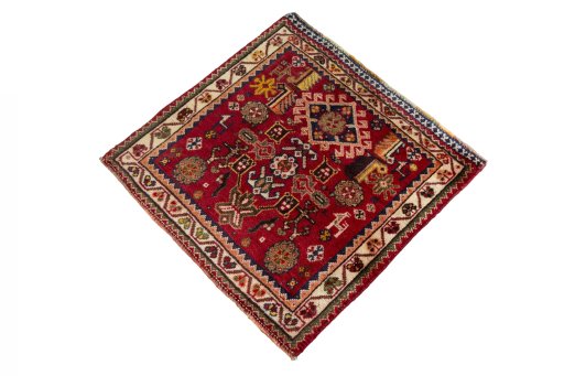 Corner detail of 2000s Shiraz rug showing border pattern and Wool pile