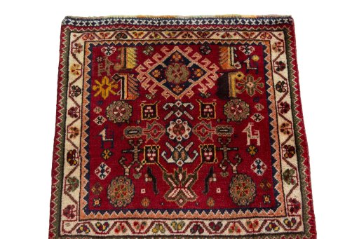 Surface texture of 2000s Shiraz rug with natural Wool and intricate pattern