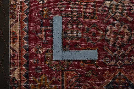 Backside of handmade 2000s Shiraz rug showing knot structure and weave density