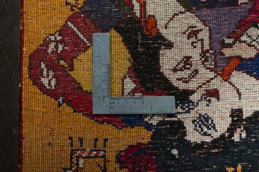 Backside of handmade 2000s Shiraz rug showing knot structure and weave density