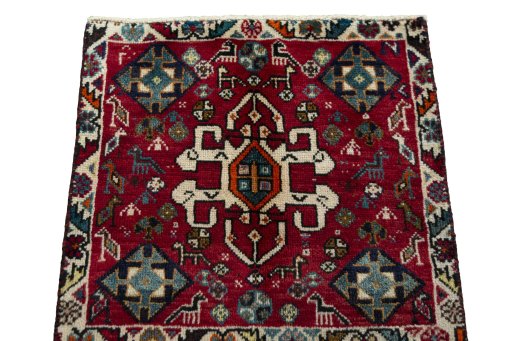 Surface texture of 2000s Shiraz rug with natural Wool and intricate pattern