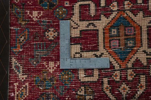 Backside of handmade 2000s Shiraz rug showing knot structure and weave density
