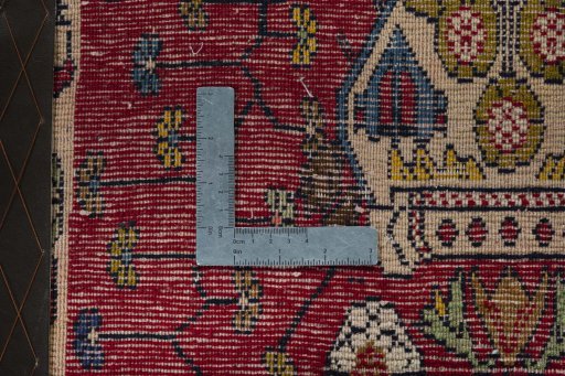 Backside of handmade 2000s Shiraz rug showing knot structure and weave density