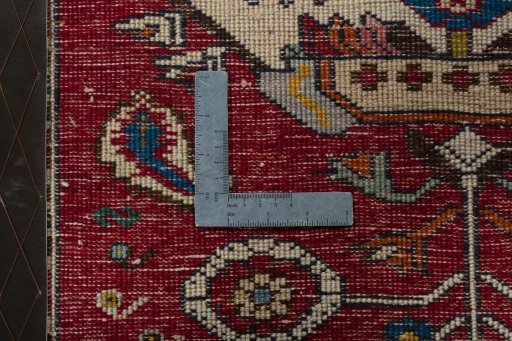Backside of handmade 2000s Shiraz rug showing knot structure and weave density