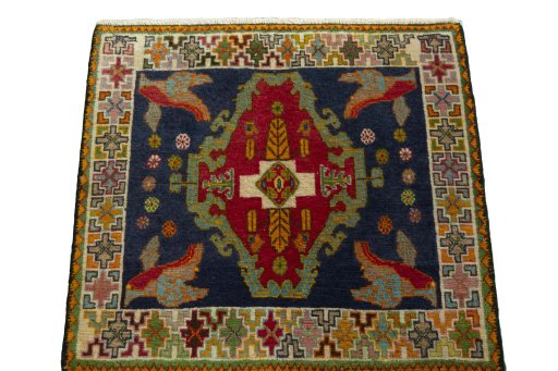 Surface texture of 2000s Shiraz rug with natural Wool and intricate pattern