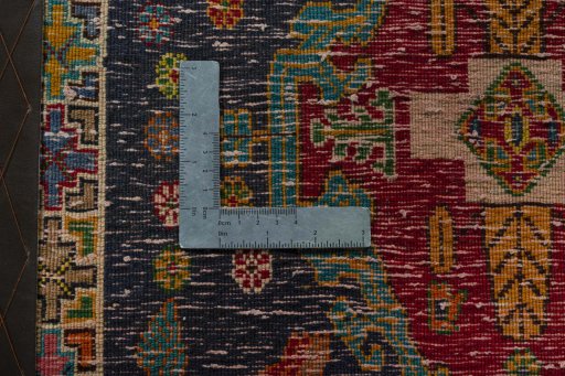 Backside of handmade 2000s Shiraz rug showing knot structure and weave density