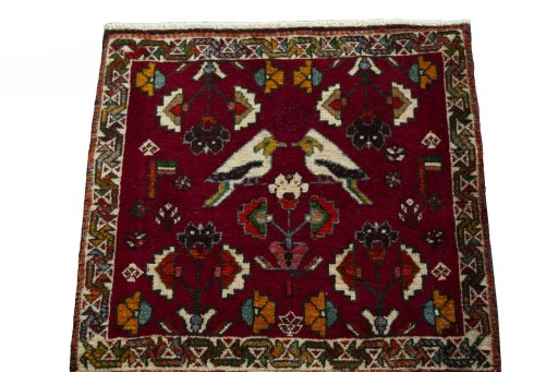 Surface texture of 2000s Shiraz rug with natural Wool and intricate pattern