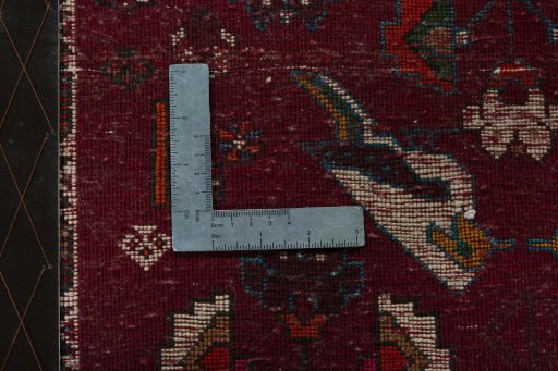 Backside of handmade 2000s Shiraz rug showing knot structure and weave density