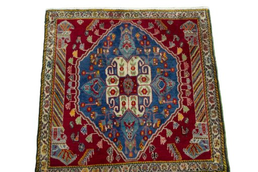 Surface texture of 2000s Shiraz rug with natural Wool and intricate pattern