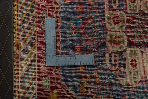 Backside of handmade 2000s Shiraz rug showing knot structure and weave density