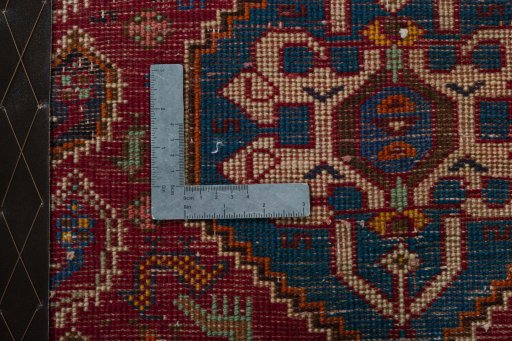 Backside of handmade 2000s Shiraz rug showing knot structure and weave density