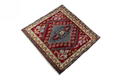 Corner detail of 2000s Shiraz rug showing border pattern and Wool pile