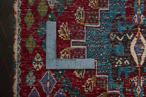 Backside of handmade 2000s Shiraz rug showing knot structure and weave density