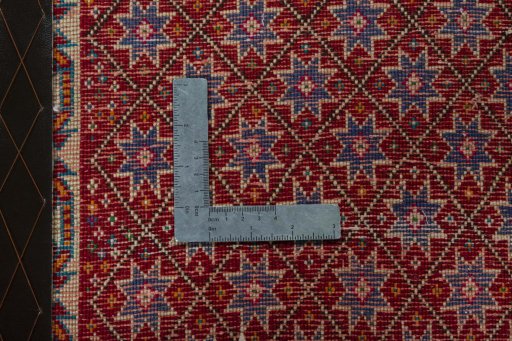 Backside of handmade 2000s Shiraz rug showing knot structure and weave density