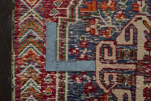 Backside of handmade 2000s Shiraz rug showing knot structure and weave density