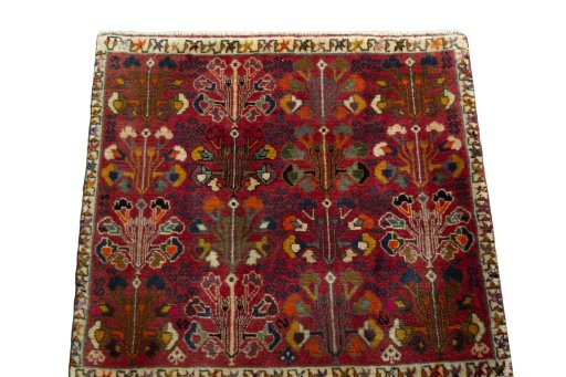 Surface texture of 2000s Shiraz rug with natural Wool and intricate pattern