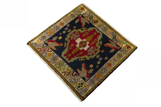 Corner detail of 2000s Shiraz rug showing border pattern and Wool pile