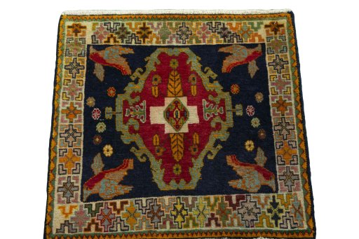Surface texture of 2000s Shiraz rug with natural Wool and intricate pattern