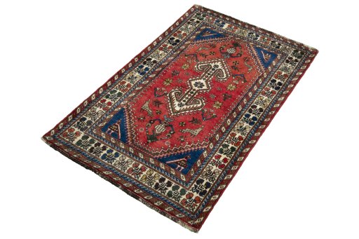 Corner detail of 2000s Shiraz rug showing border pattern and Wool pile