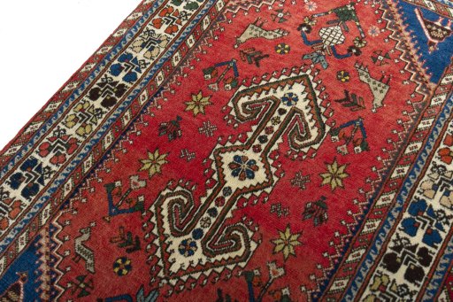 Backside of handmade 2000s Shiraz rug showing knot structure and weave density