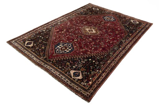 Corner detail of 2000s Shiraz rug showing border pattern and Wool pile