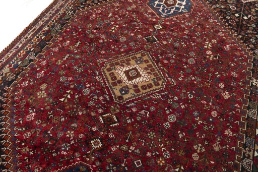 Backside of handmade 2000s Shiraz rug showing knot structure and weave density