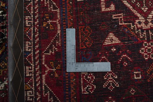Surface texture of 2000s Shiraz rug with natural Wool and intricate pattern